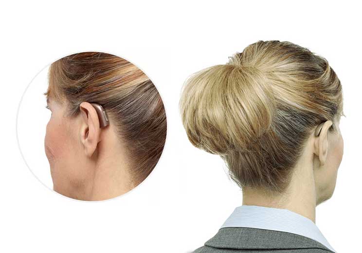 Image show how a hearing aid look on a woman