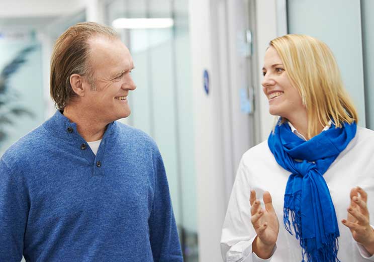 Image show man with an audiologist in a HearingLife Centre