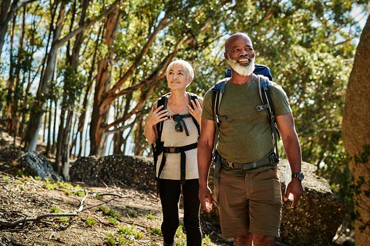 Image show man and woman hiking