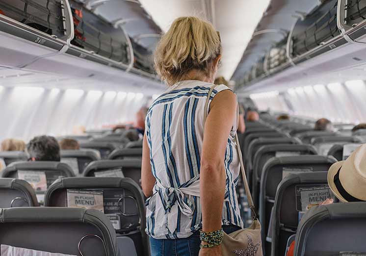 Image show woman in airplane