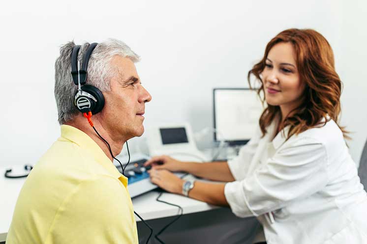 Image show man having a hearing test in a HearingLife clinic