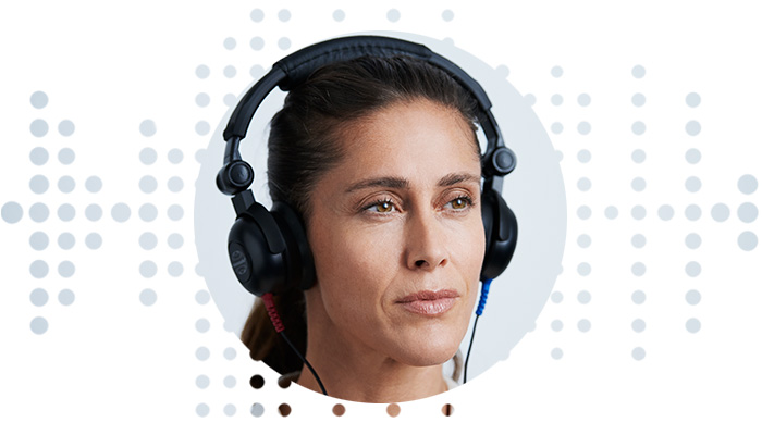 Image show woman taking a hearing test