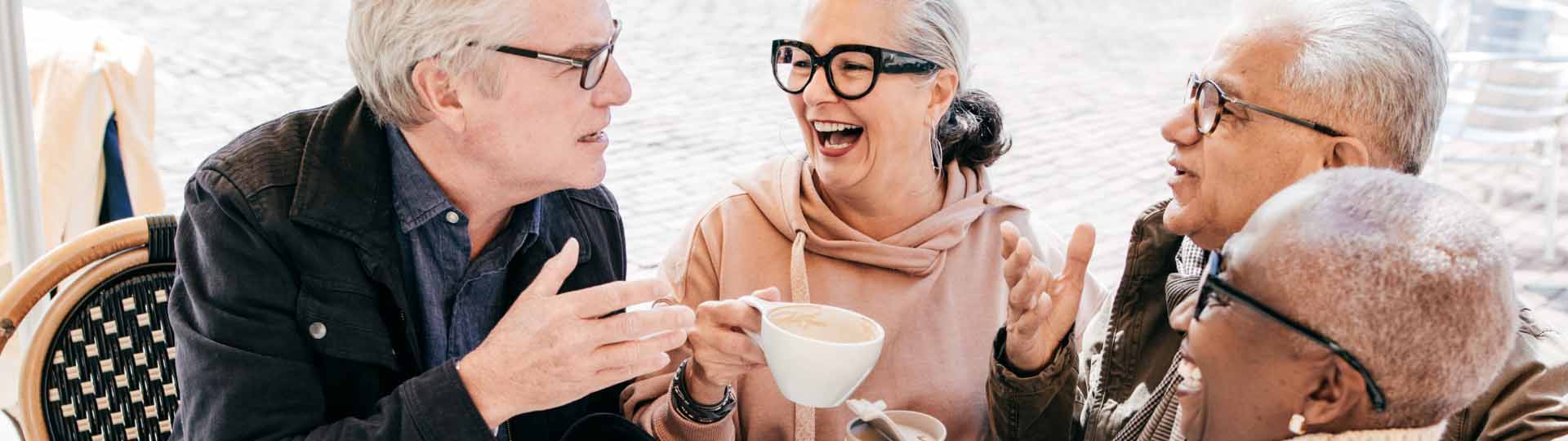 a group of people talking over coffee