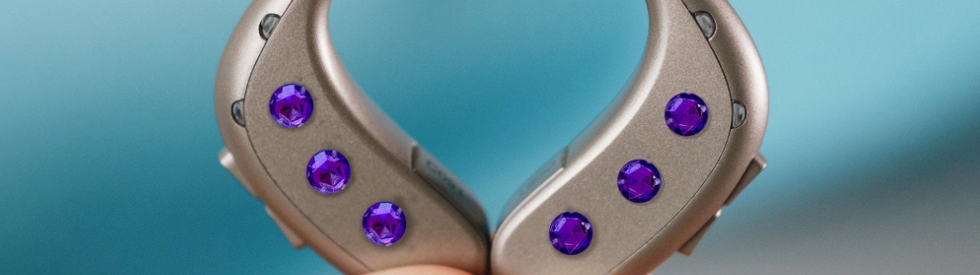 a pair of hearing aids decorated with jewels