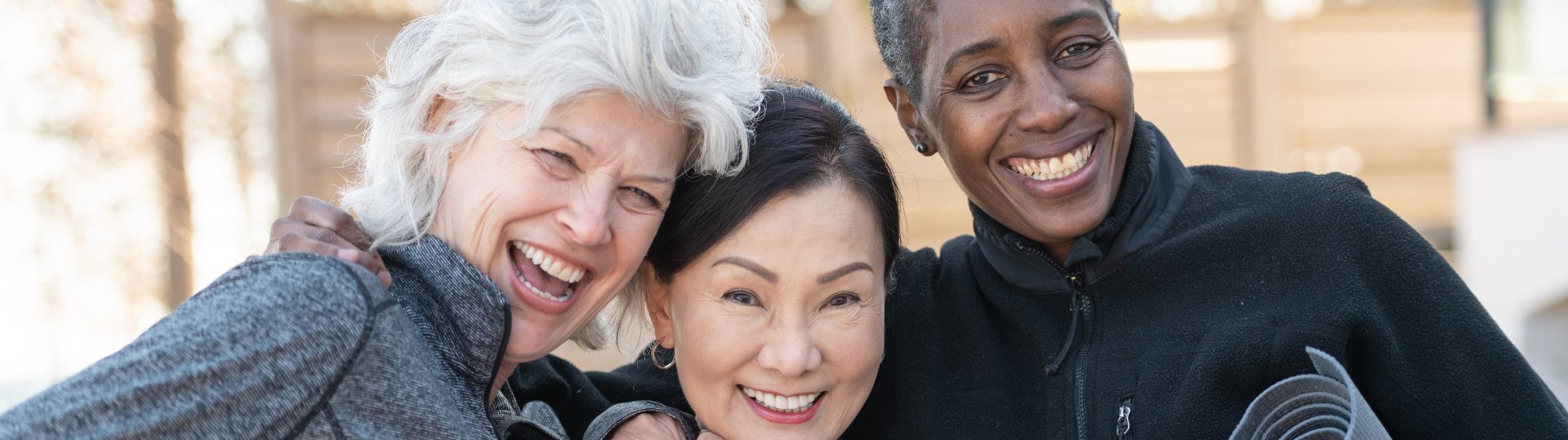 three older people smiling