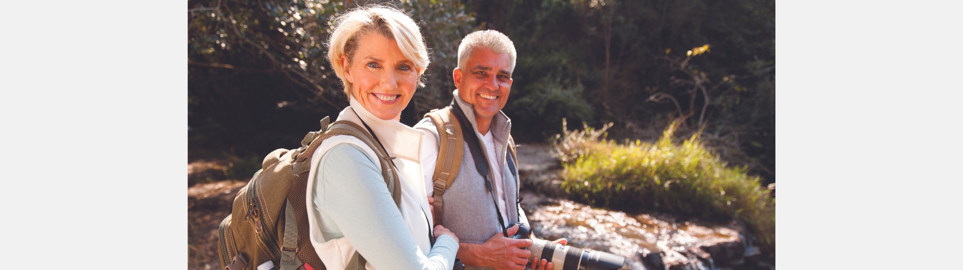 a couple hiking with hearing aids in