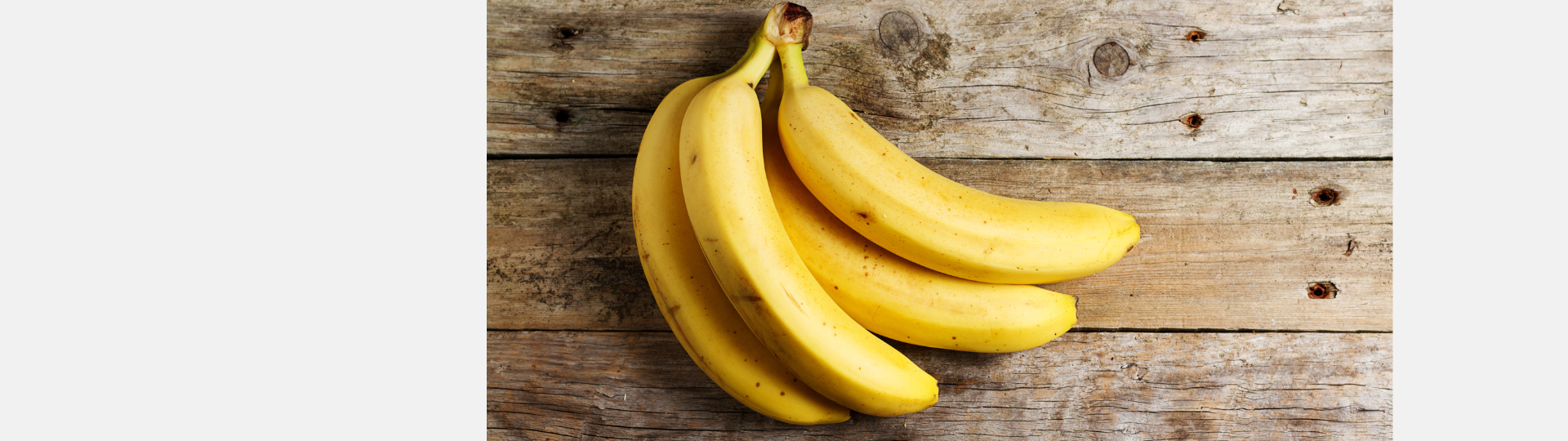 banana bunch on a wood background