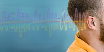 a persons ear with illustrated sound waves near it