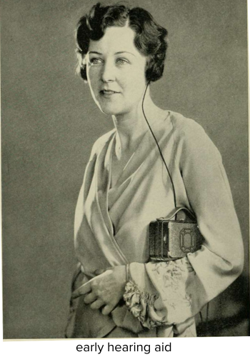 woman wearing an early hearing aid