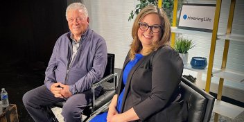 William Shatner and Dr. Rose sitting in a studio smiling at the camera