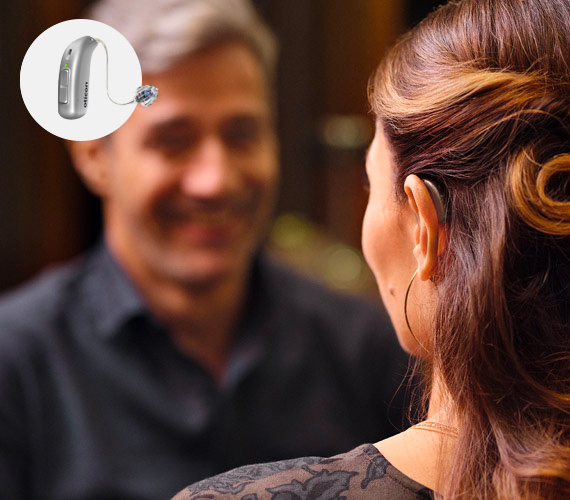 Woman wearing Oticon Real Hearing Aid