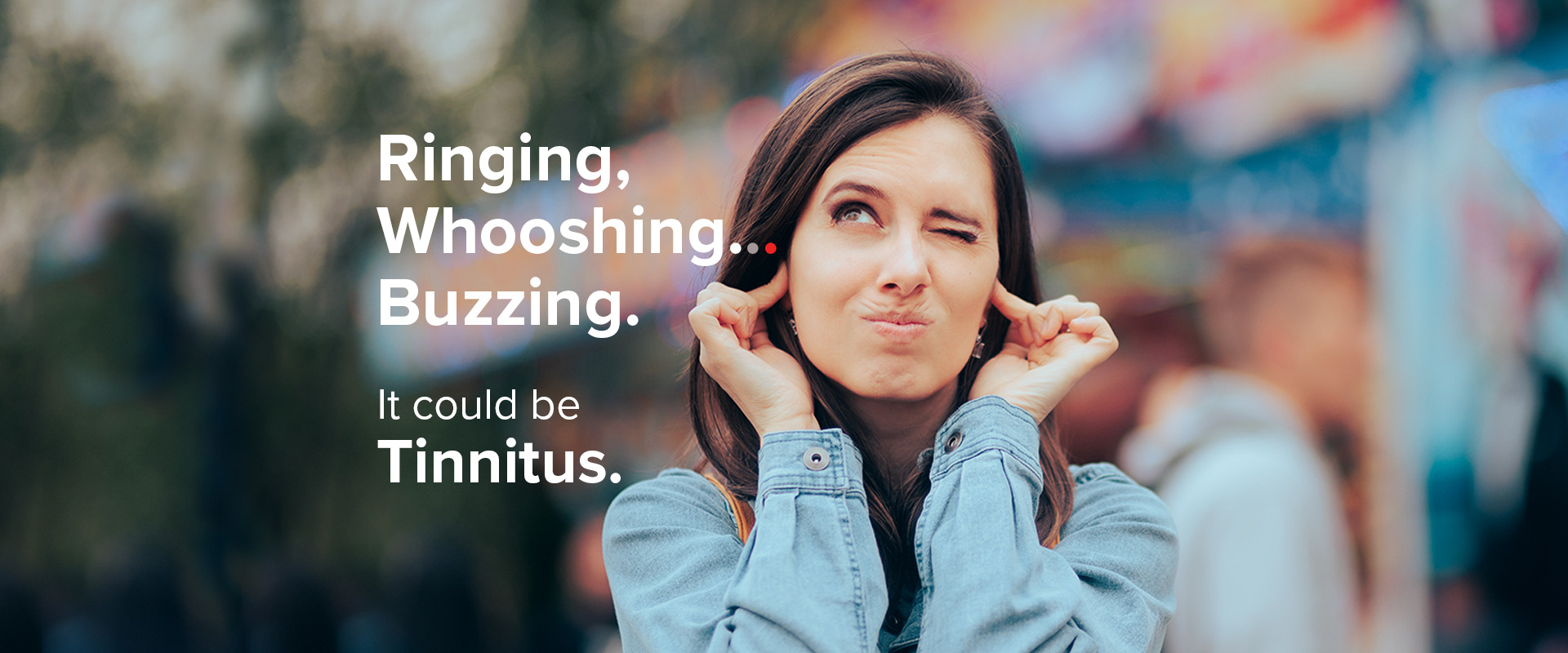 Ringing, Whooshing... Buzzing. It could be Tinnitus. -- Woman with fingers in her ears - making uncomfortable face.