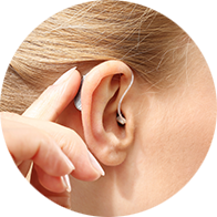 Person trying a hearing aid