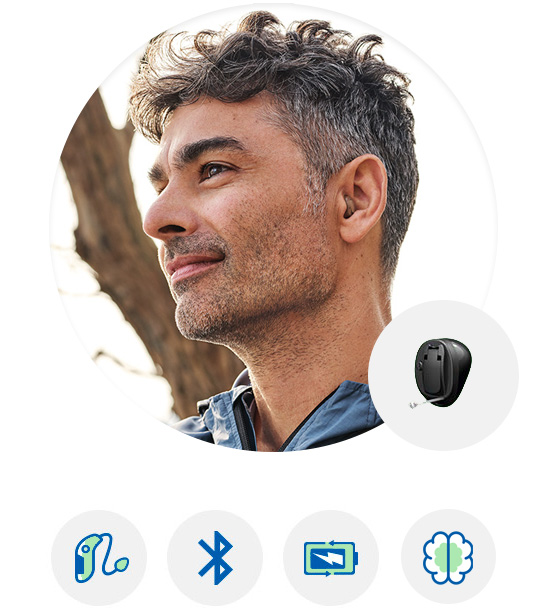 Image shows Oticon More hearing aid worn by a man