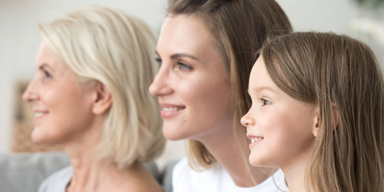 Image shows 3 generations of women, one with age-related hearing loss