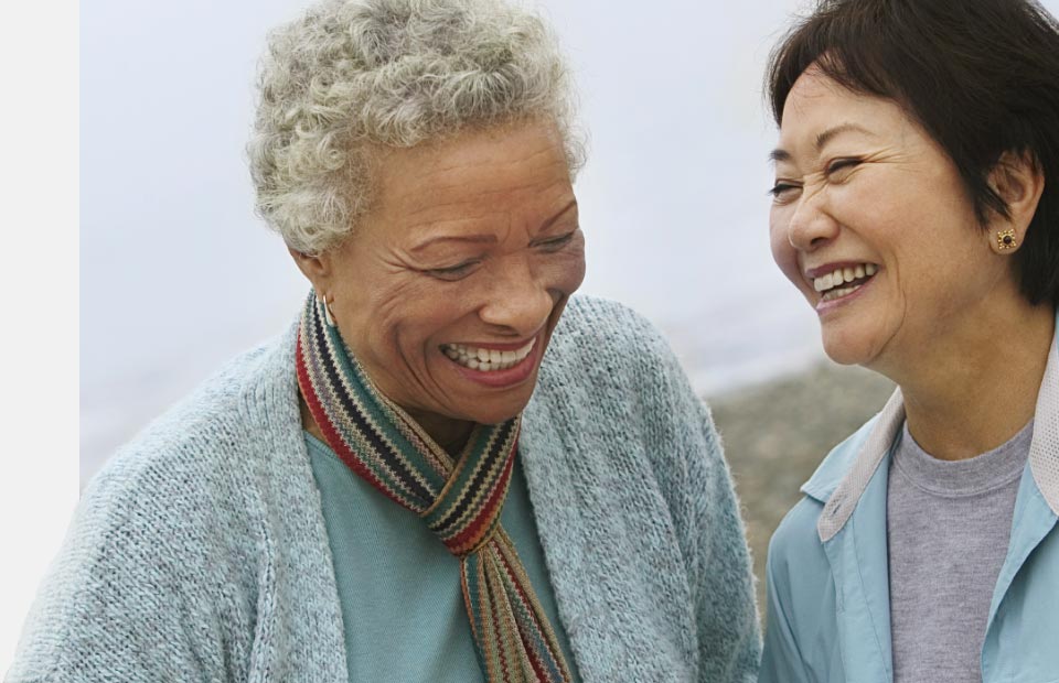Image shows women discussing what is the best hearing aid