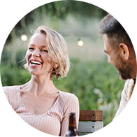 image shows happy people at dinner