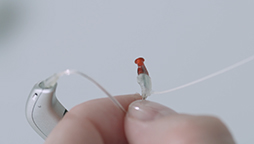 Image show How to attach an ear grip grip to your hearing aid