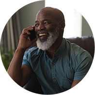 Image shows elderly man talking on the phone