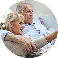 Image shows couple looking at television together