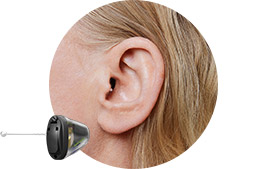 Image shows an Invisible hearing aids in ear