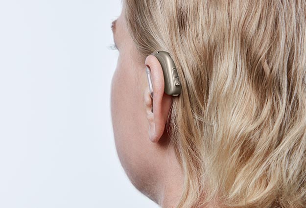 image shows hearing aids behind the ear