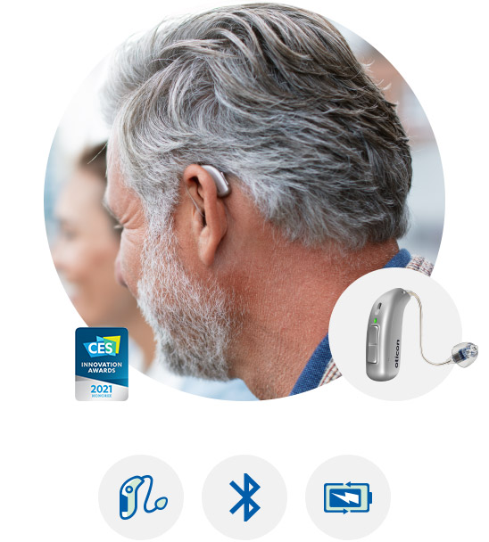 Image shows Oticon More hearing aid worn by a man