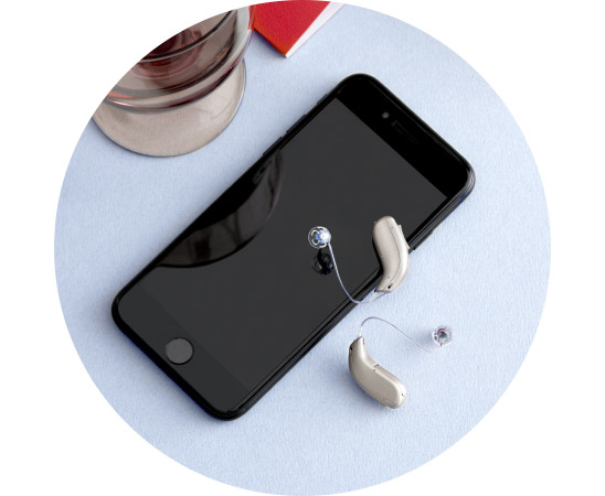 Image show hearing aids on a phone