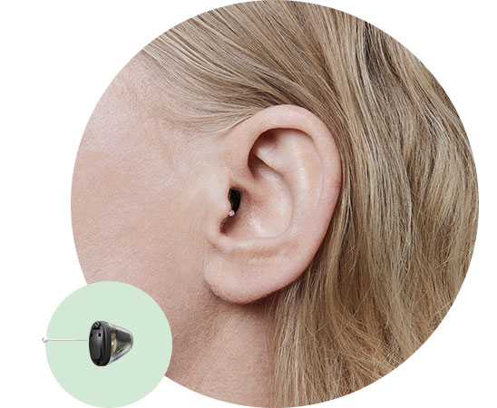 Image shows ear and an invisible-in-the-canal hearing aid